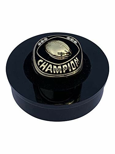 Football champion ring trophy on black base