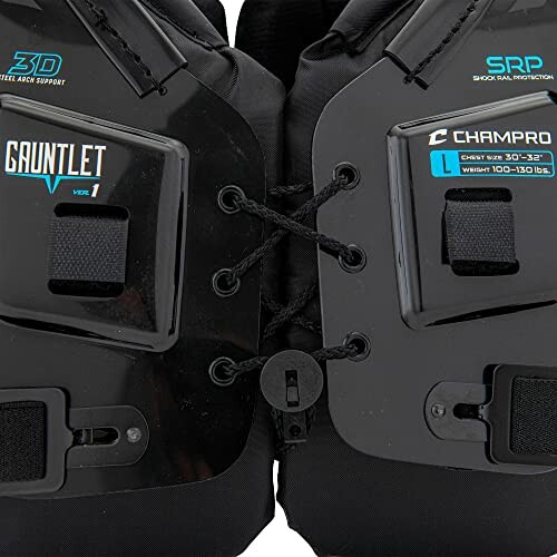 Close-up of Champro football shoulder pads with lace-up front.