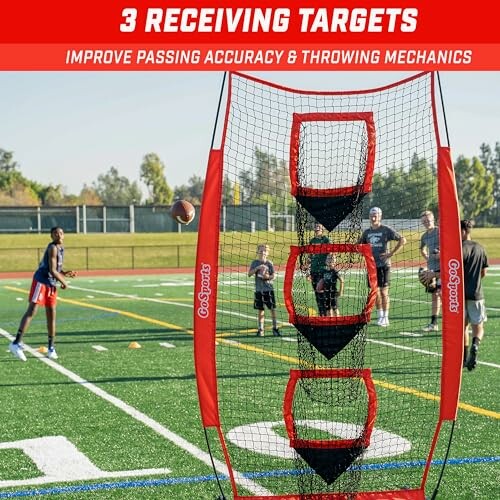 Football players practicing with a GoSports training net on a field.