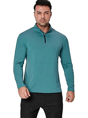 Man wearing a teal long-sleeve zip-up shirt