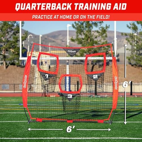 Quarterback training net with numbered targets on a field.