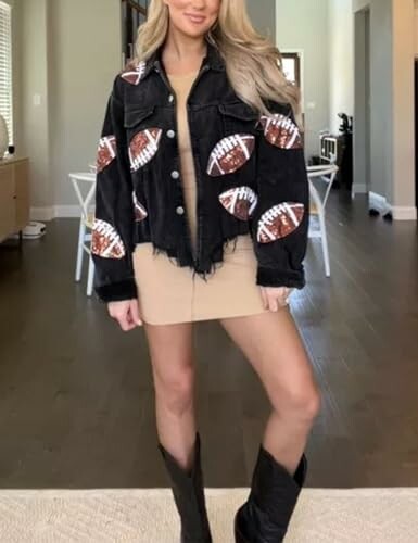 Woman wearing a football-themed denim jacket and boots.